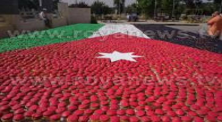 بالصور:تشكيل أكبر علم أردني من قطع الحلوى بمناسبة عيد الإستقلال