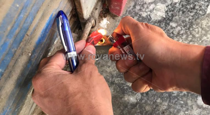 تشميع محل تجاري بالشمع الأحمر