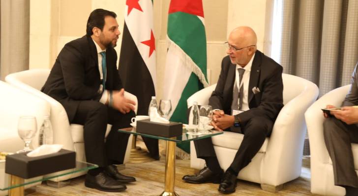رئيس مجلس مفوضي الهيئة المستقلة للانتخاب موسى المعايطة و رئيس اللجنة العليا لإدارة الانتخابات لمجلس الشعب السوري محمد طه الأحمد