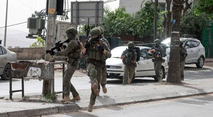 "Israeli" forces storm six West Bank cities in sweeping overnight raids