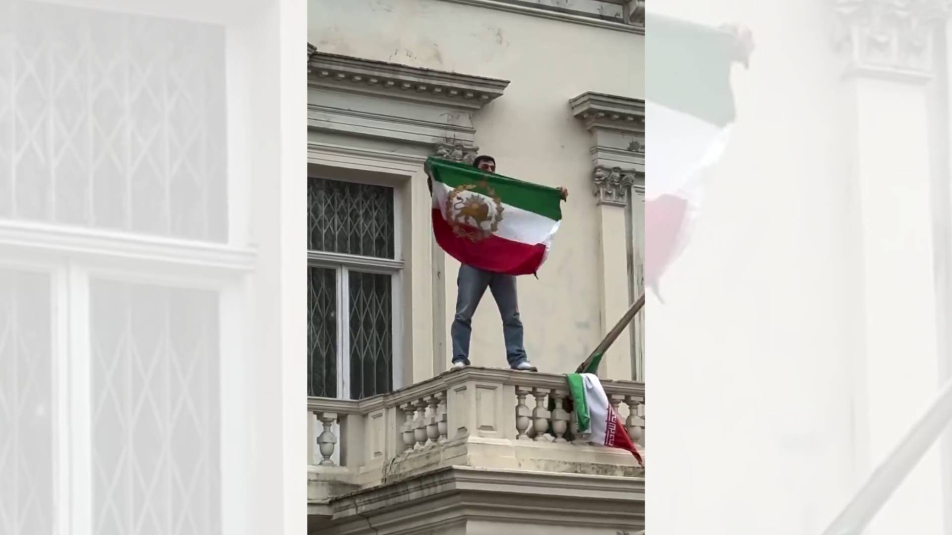 Protester puts pre-Islamic revolution Iran flag on London embassy
