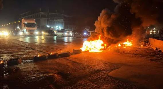 Protesters unload garbage trucks at govt. offices in Libya