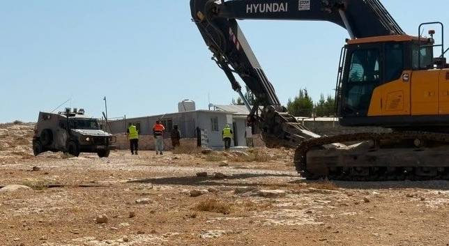 'Israeli' forces demolish West Bank elementary school as settlers torch vehicles