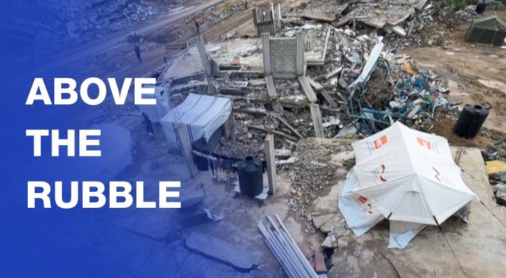 Family sets up tent above the rubble of their destroyed Gaza City home