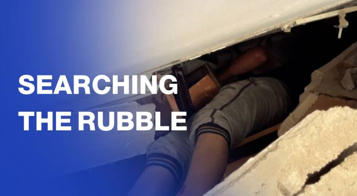 Palestinians search rubble of building hit by “Israeli” strike in Gaza City