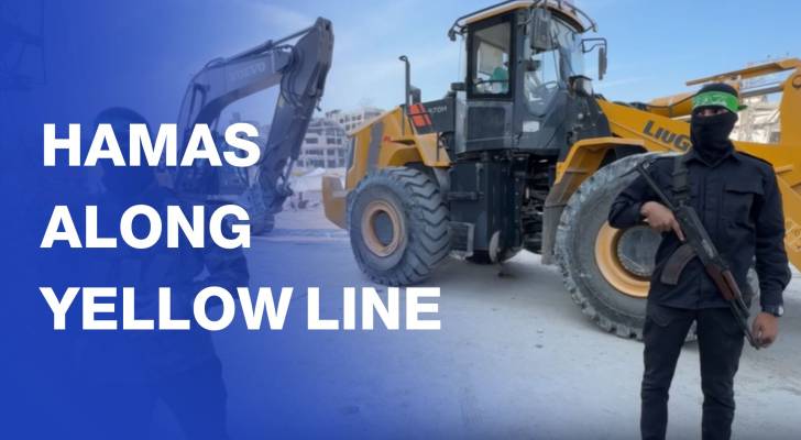 Hamas fighters, Red Cross vehicles wait to cross Gaza’s Yellow Line
