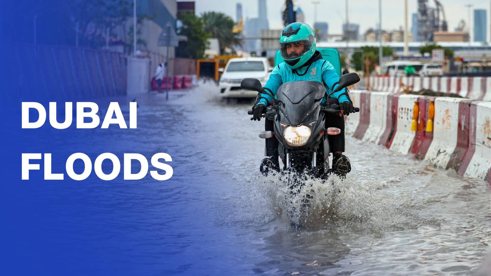 Cars drive through flooded Dubai streets