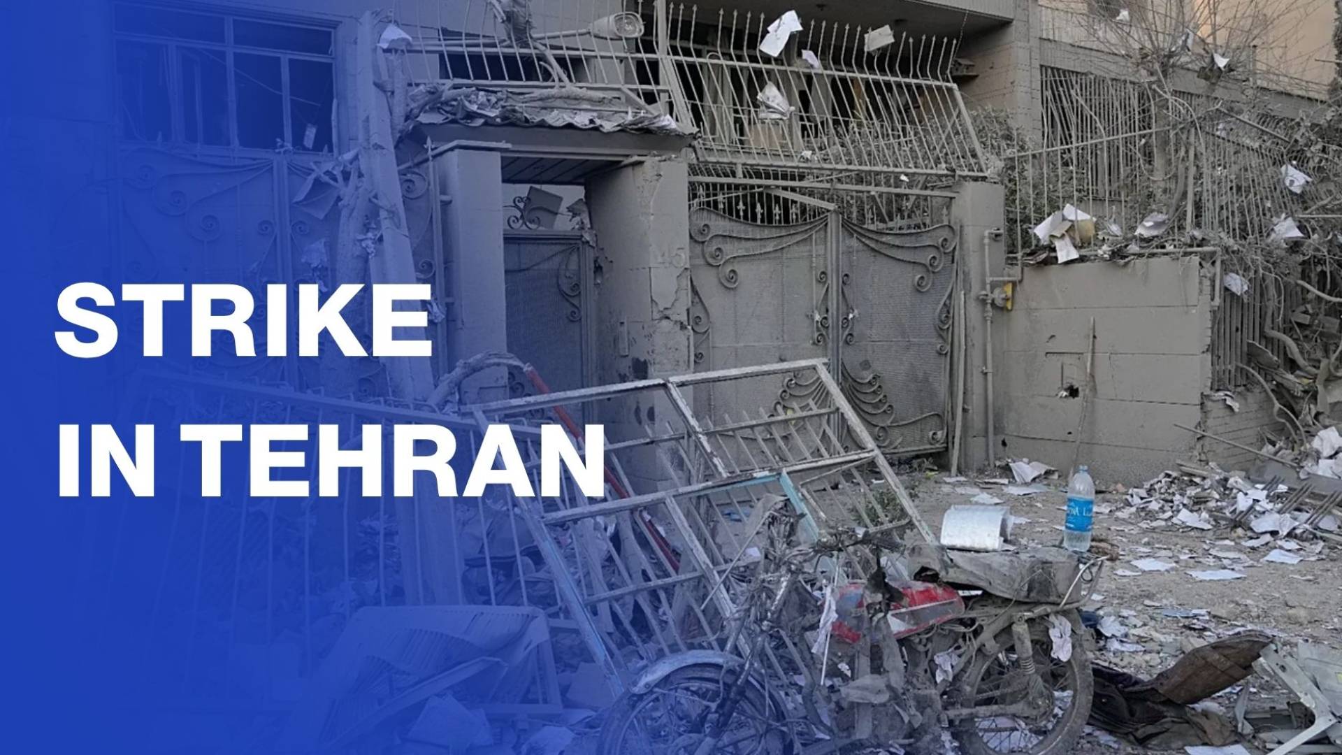 Tehran street reduced to wreckage after early war strike