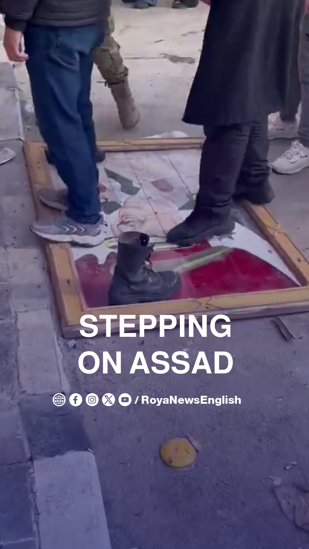 Ex-Syrian regime soldiers surrender weapons while stepping on Assad’s portrait