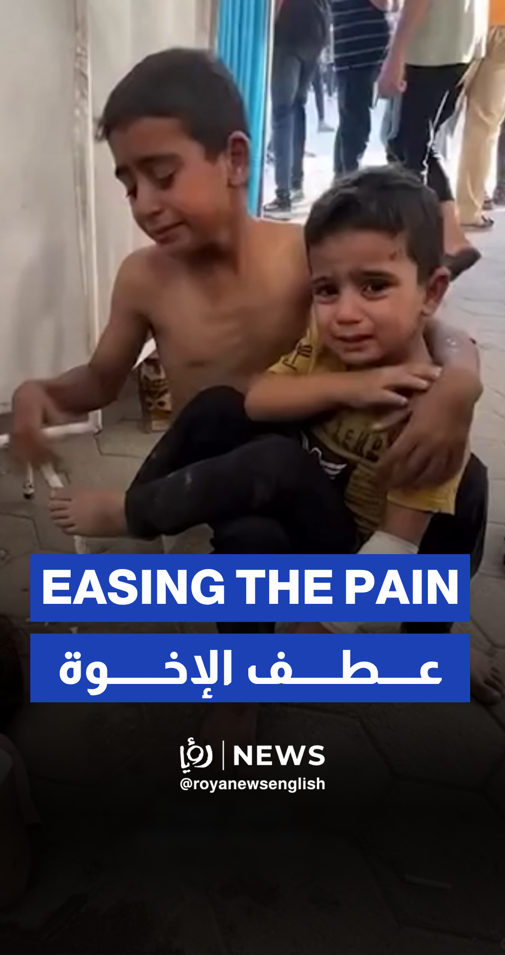 Injured child comforts siblings after “Israeli” strike on shelter