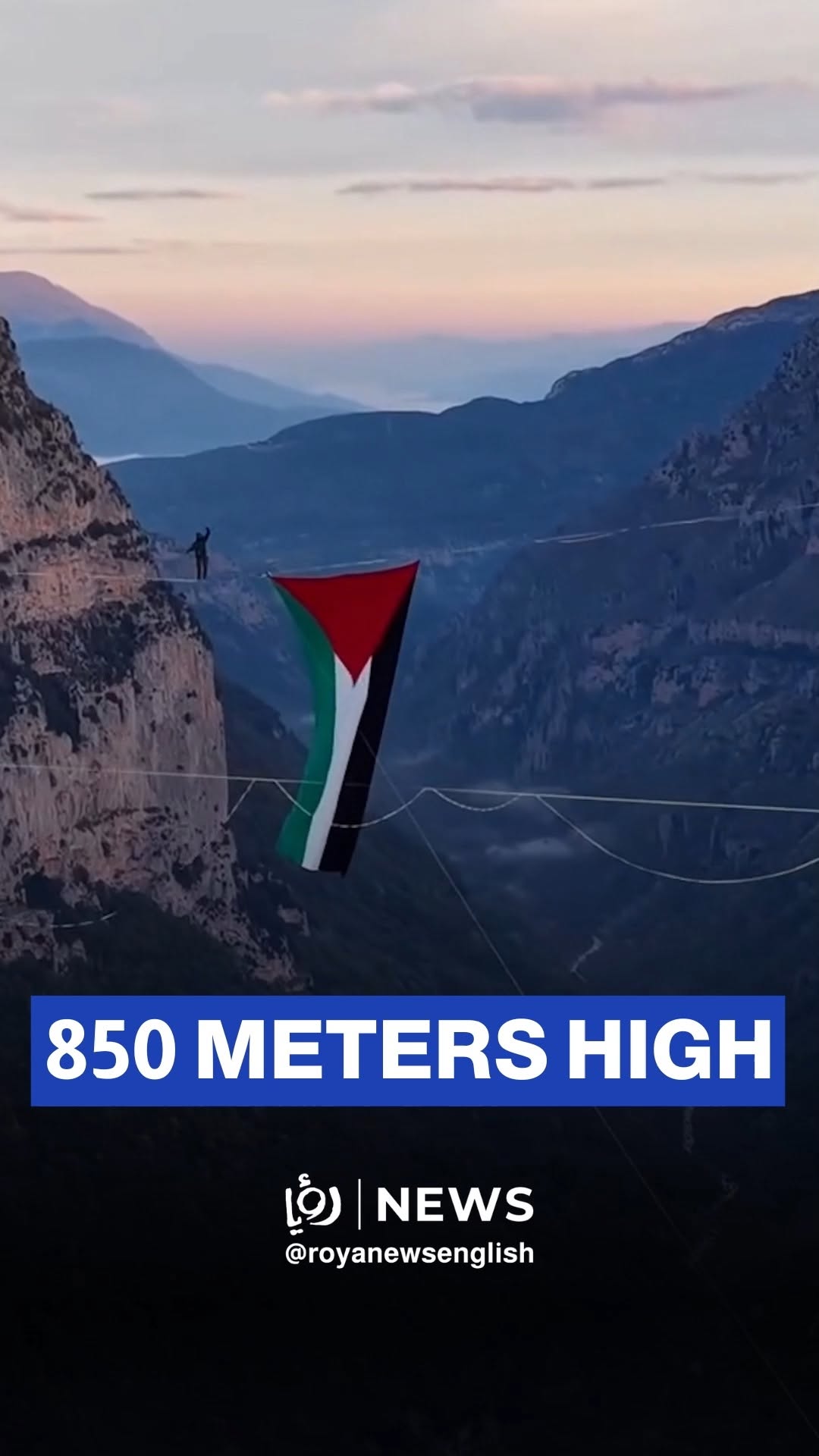 Two people cross 1km on a tightrope waving Palestinian flag