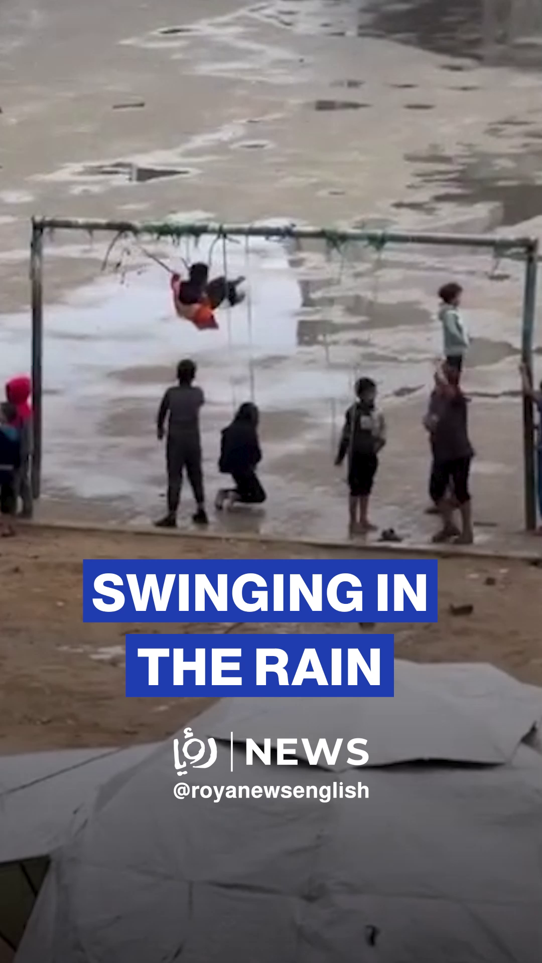 Gazan children enjoy a moment on the swings amid rain