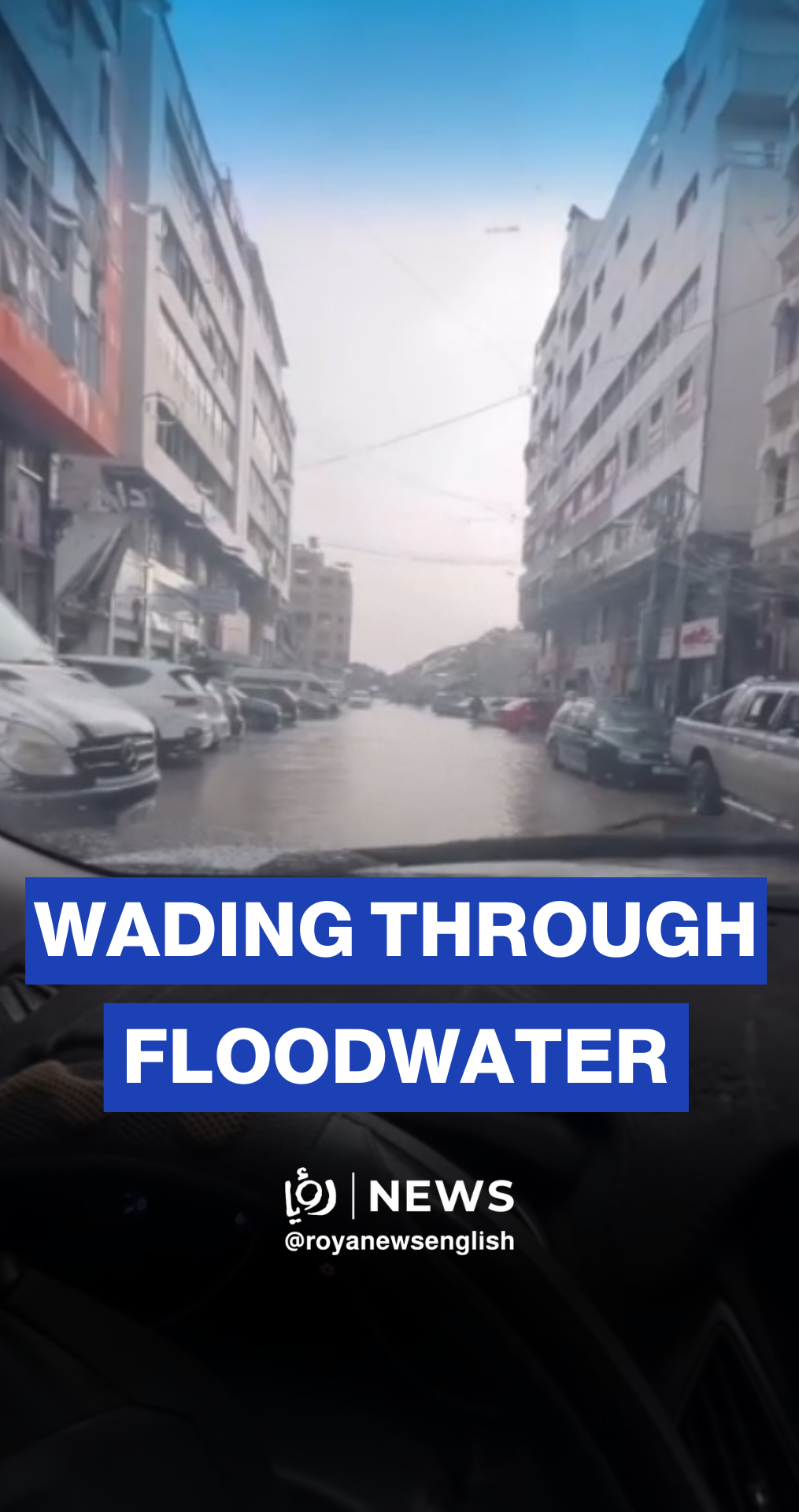 Palestinians wade through floodwaters in Gaza City