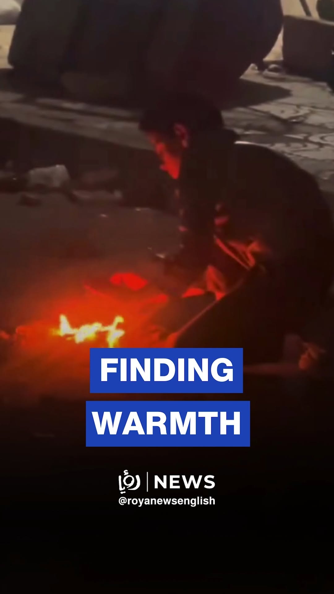 Palestinian child lights fire from trash to keep warm