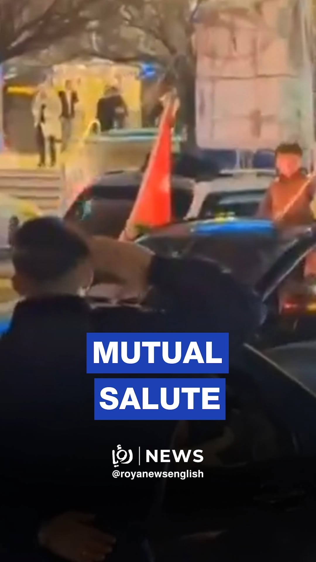 Jordanian officer salutes child with Syrian flag