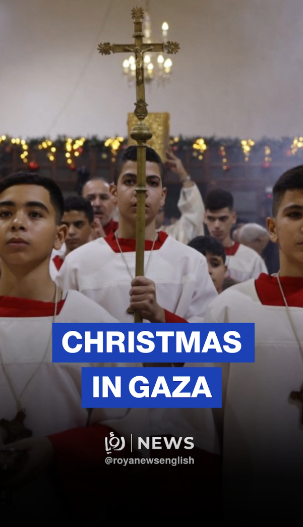 Palestinian Christians celebrate Christmas Mass at Holy Family Church