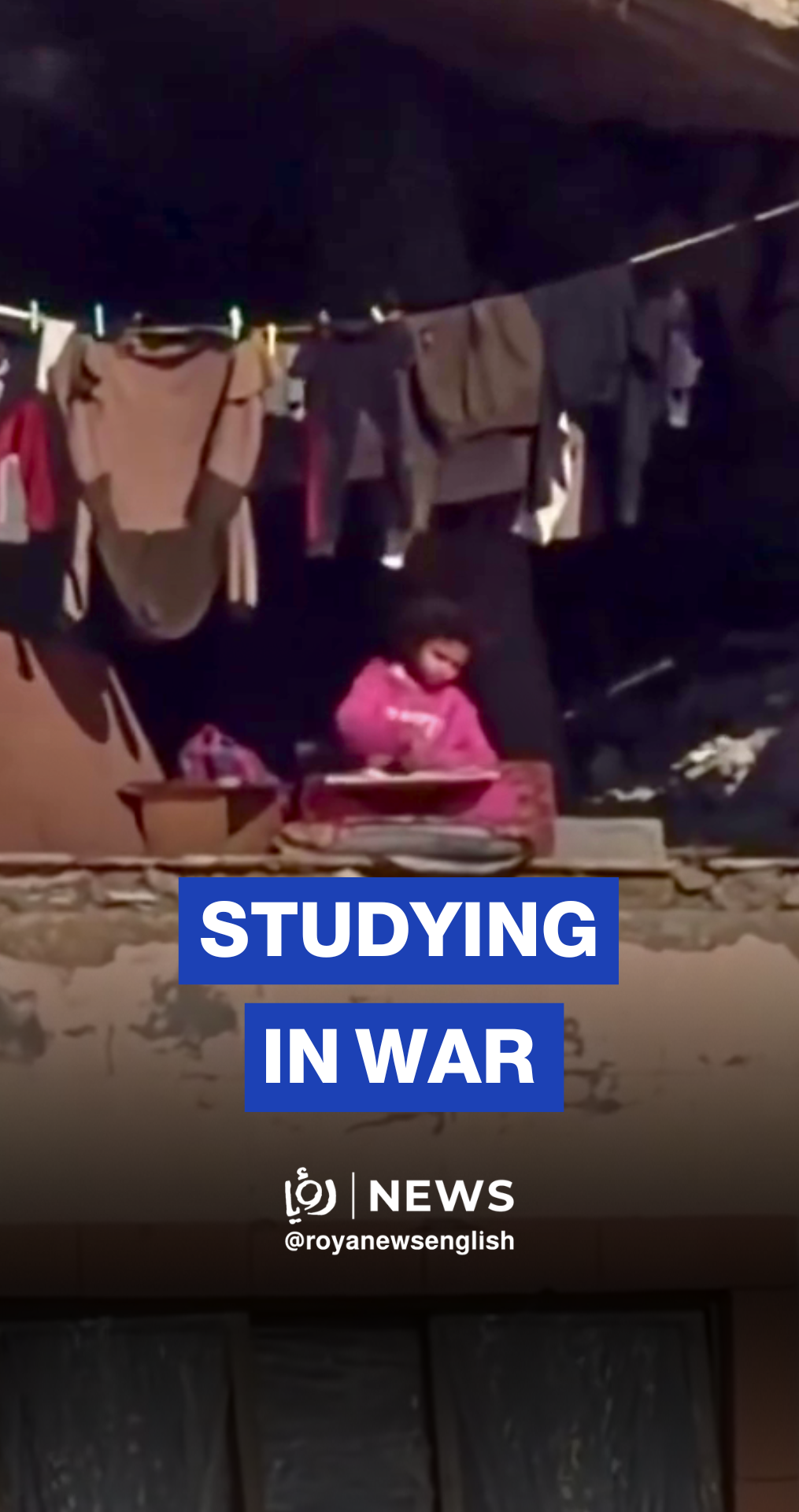 Little girl spotted studying in war-torn building