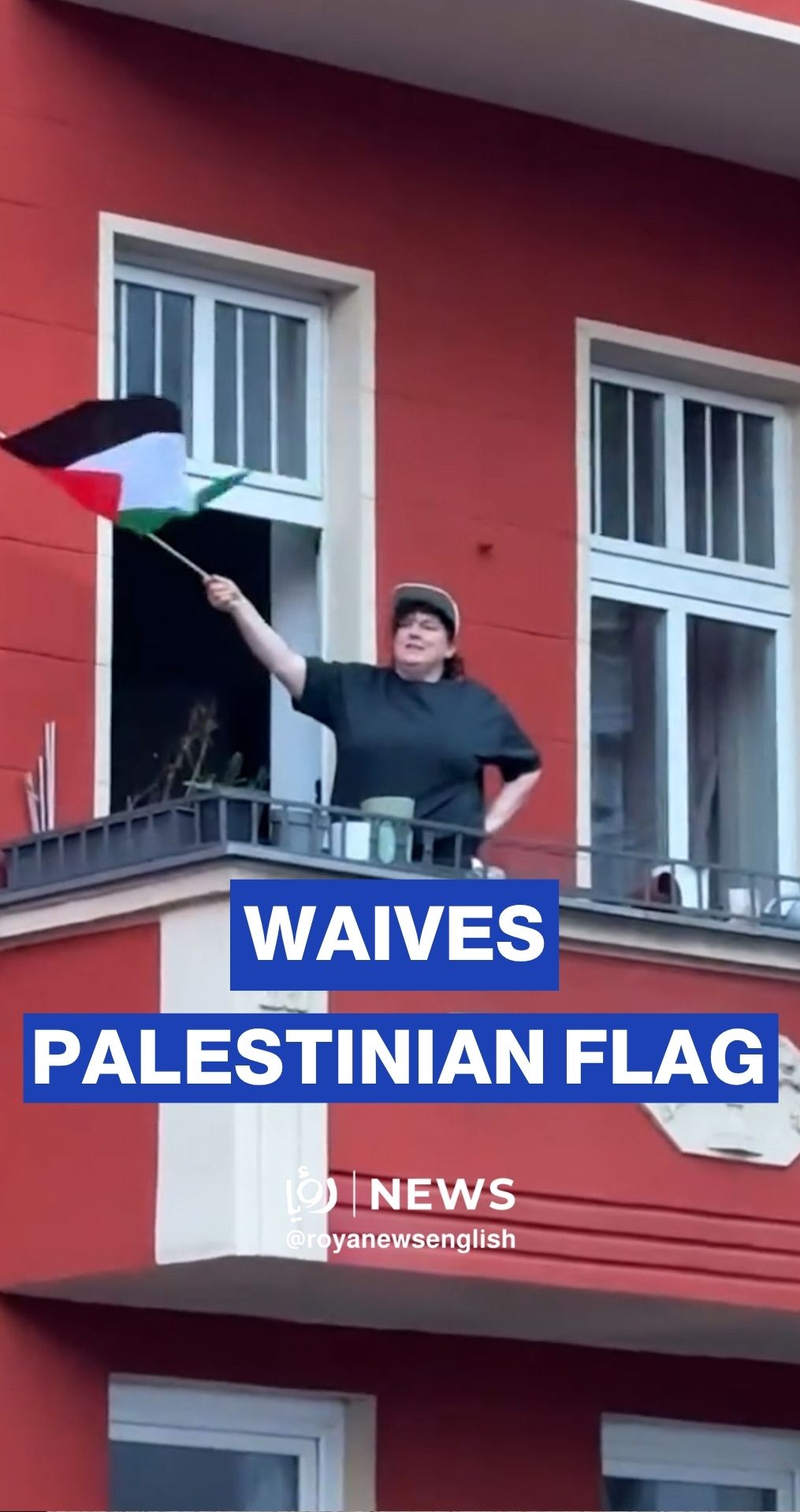 Woman waves Palestinian flag from balcony as protests sweep Berlin